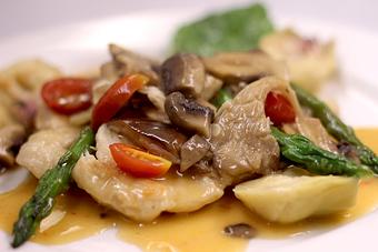 Product: Cooked in white wine with garlic, artichoke hearts, wild mushrooms, asparagus & grape tomatoes - La Mezzaluna in Princeton, NJ Italian Restaurants
