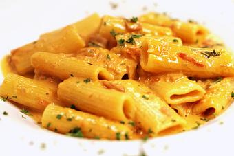 Product: Sauteed with vodka, heavy cream & grape tomatoes, topped with fresh shallots - La Mezzaluna in Princeton, NJ Italian Restaurants