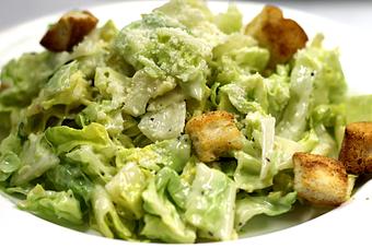Product: Romaine tossed in a homemade Caesar dressing, topped with fresh croutons - La Mezzaluna in Princeton, NJ Italian Restaurants