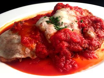 Product: Shallow-fried chicken breast cooked in a hearty marinara & topped with fresh mozzarella - La Mezzaluna in Princeton, NJ Italian Restaurants