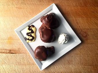 Product: Light & airy chocolate cream puffs covered in whipped cream & chocolate mousse - La Mezzaluna in Princeton, NJ Italian Restaurants