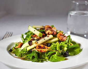 Product: Super Food Baby Kale Salad with organic apples, candied walnuts, dried blueberries, and superseed vinaigrette - La Tour Restaurant in Vail, CO French Restaurants