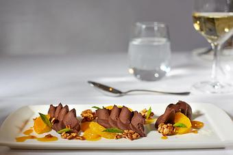 Product: with orange supremes, oat and date crust, and orange sauce - La Tour Restaurant in Vail, CO French Restaurants