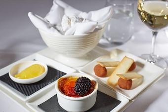 Product: dessert trio with mini crème brulée, chocolate truffles, madeleines, and lemon curd - La Tour Restaurant in Vail, CO French Restaurants
