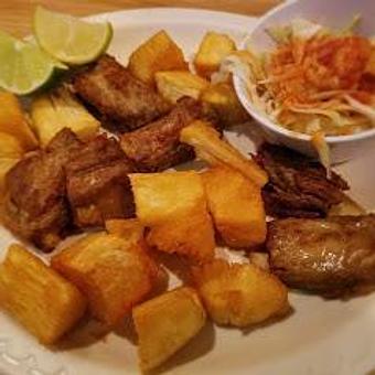 Product: Fried bone-in pork rib with fried yuca. - La Union Restaurant in Arlington, VA Mexican Restaurants