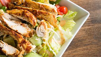 Product: Marinated chicken or shrimp, romaine lettuce, cucumbers, cherry tomatoes, avocado slices, sweet corn and shredded Monterey Jack cheese served with our smoky and spicy chipotle dressing. - Las Brisas Mexican Restaurant in Edmonds, WA Steak House Restaurants
