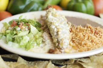 Product: Crunchy Relleno served over slow cooked brisket - Leal's Mexican Restaurant in Plainview, TX Mexican Restaurants