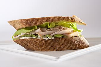 Product: Fresh roasted turkey, avocado, butter lettuce and mayonnaise on our French country loaf. - Les Madeleines in Salt Lake City, UT Bakeries
