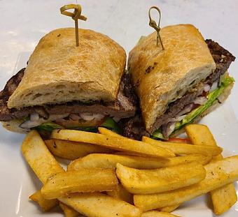 Product: PRIME Rib Eye/ red onion/ tomato/ garlic ciabatta roll - LG's Prime Steakhouse in Palm Springs, CA Steak House Restaurants