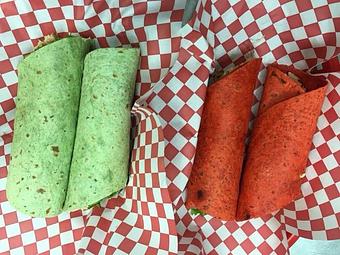 Product: 12" Chicken Lip wrap with 2 chicken lips, lettuce, cheese, and choice of Ranch or Blue Cheese cut in half for 2 - 6" sandwiches !!! - Lips To Go in Burlington, IA Wings Restaurants