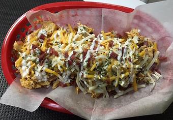 Product: 3 Potato Skins Topped with shredded chicken, cheese, bacon, and chives with choice of Ranch or Blue Cheese - Lips To Go in Burlington, IA Wings Restaurants