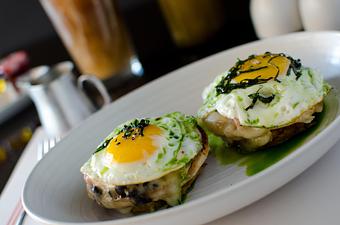 Product: english muffin, black beans, swiss cheese, ham, fried eggs, pickled mojo sauce, mashed sweet plantain - LT Steak & Seafood in South Beach - Miami Beach, FL Steak House Restaurants