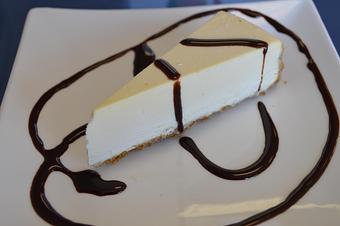 Product: Cheesecake - your choice: plain or with chocolate or strawberry syrup - Mario's Pizza & Grill in Knoxville, TN Pizza Restaurant