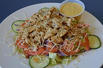 Product: Awesome fried chicken salad with fresh chicken tenders hand breaded made to each order. - Mario's Pizza & Grill in Knoxville, TN Pizza Restaurant