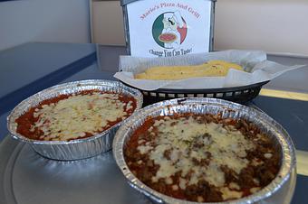 Product: Spaghetti shown with beef sauce in front and just marinara on the left. Also available with homemade meatballs, sausage or shrimp. Served with 3 homemade breadsticks. - Mario's Pizza & Grill in Knoxville, TN Pizza Restaurant