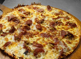 Product: Thin Crust Meat Feast Pizza - Merlin's Pizza (Destin) in Destin, FL Pizza Restaurant