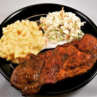 Product: Pork steak plate with coleslaw and macaroni & cheese. - Meyer's Elgin Smokehouse in Elgin, TX Barbecue Restaurants