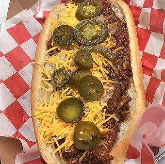 Product: Cujo - sausage dog on whole wheat hoagie topped with 3 mistake chili, cheese, jalapenos, onions and texas gold mustard sauce. - Meyer's Elgin Smokehouse in Elgin, TX Barbecue Restaurants