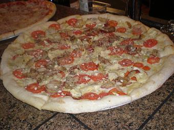 Product: 220 different slice pies - Mezza Luna Pizzeria - Downtown: in Eugene/Springfield, OR Pizza Restaurant