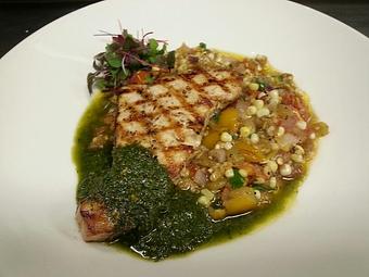 Product: Wood-fired Block Island Swordfish over pan fried sweet corn with roasted green chilis and cherry tomatoes garnished with basil pesto - Michael Anthony's at the Inn in Versailles, OH Restaurants/Food & Dining