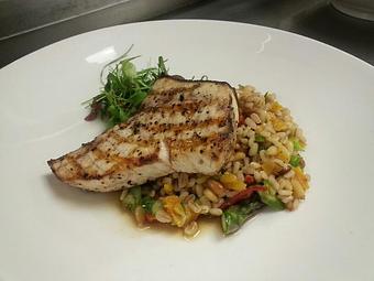 Product: Wood-fired Carolina Swordfish with shaved local asparagus, dried apricot, sun-dried tomatoes, toasted pine nuts, and spring onion barley salad - Michael Anthony's at the Inn in Versailles, OH Restaurants/Food & Dining