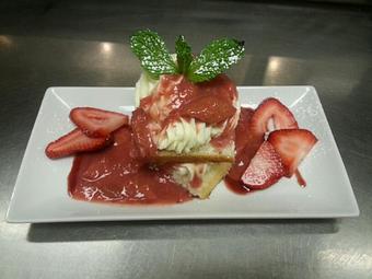 Product: House made white cake layered with vanilla rum mascarpone fresh cut strawberries and topped with a strawberry rhubarb preserve - Michael Anthony's at the Inn in Versailles, OH Restaurants/Food & Dining