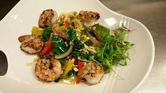 Product: Fresh egg linguine with sautéed bell peppers, red onion, sweet corn, cherry tomatoes, fresh kale, scallions and cilantro in a jalapeno and lime Buerre Blanc, topped with wood-fired gulf shrimp - Michael Anthony's at the Inn in Versailles, OH Restaurants/Food & Dining