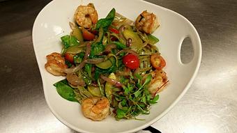 Product: Fresh spinach linguine with sautéed gulf shrimp, snow peas, zucchini, yellow squash, red onion, pancetta, cherry tomatoes and basil in a light butter - Michael Anthony's at the Inn in Versailles, OH Restaurants/Food & Dining