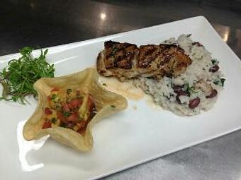 Product: Wood-fired Black Grouper over a coconut milk and fresh cilantro red beans with jasmine rice. Garnished with a pineapple pico de gallo - Michael Anthony's at the Inn in Versailles, OH Restaurants/Food & Dining