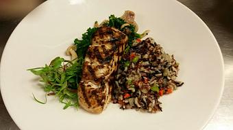 Product: Wild caught Rhode Island striped bass over a red, wild, and jasmine rice pilaf and sautéed kale with wild mushrooms and crispy shallots - Michael Anthony's at the Inn in Versailles, OH Restaurants/Food & Dining