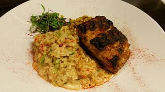 Product: Bronzed wild striped Bass over a creamy crawfish risotto and roasted sweet corn with seasoned salt. - Michael Anthony's at the Inn in Versailles, OH Restaurants/Food & Dining