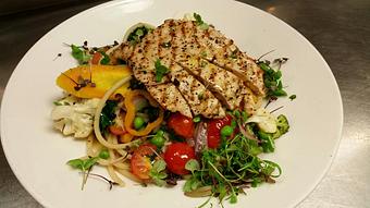 Product: Bucatini pasta with sauteed broccoli, cauliflower, heirloom carrots, red onion, mini sweet bell peppers, cherry tomatoes, fresh basil and kale, topped with grilled chicken - Michael Anthony's at the Inn in Versailles, OH Restaurants/Food & Dining