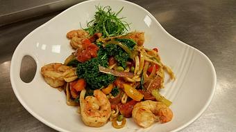 Product: Fresh black pepper linguine with sautéed gulf shrimp, English peas, Andouille sausage, bell peppers, onions, and kale in a pan-made Cajun tomato sauce - Michael Anthony's at the Inn in Versailles, OH Restaurants/Food & Dining