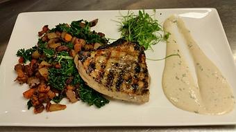 Product: Wood-fired Swordfish over a Peruvian purple and sweet potato hash, with smoked pancetta and kale, garnished with roasted garlic aioli - Michael Anthony's at the Inn in Versailles, OH Restaurants/Food & Dining