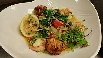 Product: Fresh black pepper linguine with sauteed gulf shrimp, shallots, kale, basil, cherry tomatoes and capers in a lemon white wine butter topped with seared jumbo scallops - Michael Anthony's at the Inn in Versailles, OH Restaurants/Food & Dining