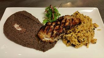 Product: Wood-fired wild caught Grouper with black bean puree and a saffron wild rice pilaf with raisins and fresh mint - Michael Anthony's at the Inn in Versailles, OH Restaurants/Food & Dining