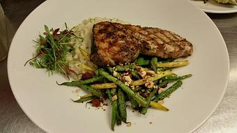 Product: Wood-fired Swordfish over creamy risotto with Houtz cheese and chives, sauteed with French green beans and smoked pancetta, topped with toasted almonds - Michael Anthony's at the Inn in Versailles, OH Restaurants/Food & Dining