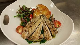 Product: Fresh spinach linguine with sauteed red onion, cherry tomatoes, Kalamata olives, fresh kale and grilled chicken, topped with fried Burrata cheese - Michael Anthony's at the Inn in Versailles, OH Restaurants/Food & Dining