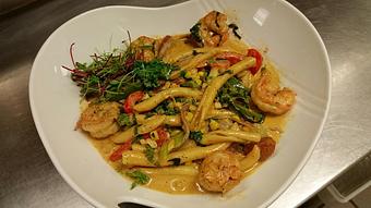 Product: Strozzapretti pasta with sauteed gulf shrimp, Andouille sausage, red onion, sweet corn, tricolor bell peppers, celery, fresh basil and kale in a Cajun cream sauce - Michael Anthony's at the Inn in Versailles, OH Restaurants/Food & Dining