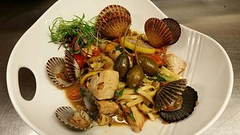 Product: Fresh egg linguine with Taylor Bay scallops, sauteed Block Island Swordfish, capers, cherry tomatoes and fresh basil in a white wine lemon sauce - Michael Anthony's at the Inn in Versailles, OH Restaurants/Food & Dining