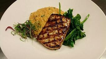 Product: Wood-fired Block Island Swordfish over a roasted red bell pepper risotto with Hull's Trace cheddar, chives and sautéed ice root spinach. - Michael Anthony's at the Inn in Versailles, OH Restaurants/Food & Dining