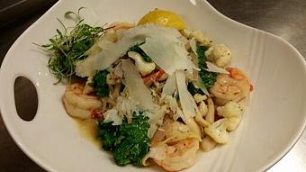 Product: Fresh black pepper linguine with sauteed jumbo shrimp, local cauliflower, wild mushrooms, shallots, sun dried tomatoes, and kale in a white wine, lemon and rosemary sauce topped with Pecorino Romano cheese. - Michael Anthony's at the Inn in Versailles, OH Restaurants/Food & Dining