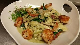 Product: Fresh spinach linguine with sauteed wild mushrooms, cauliflower, shallots, ice root spinach, and sundried tomatoes in a white wine and pesto cream sauce, topped with pan-seared Georges Bank scallops. - Michael Anthony's at the Inn in Versailles, OH Restaurants/Food & Dining