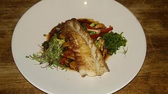 Product: Pan seared Cod seasoned with Chinese five spice, served over sauteed wild mushrooms, heirloom carrots, broccoli, and bell pepper in an Asian plum sauce with wakame garnish. - Michael Anthony's at the Inn in Versailles, OH Restaurants/Food & Dining