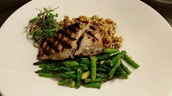 Product: Wood fired Mahi Mahi over a pearled barley salad with fresh herbs and dried fruit, accompanied by sauteed asparagus. - Michael Anthony's at the Inn in Versailles, OH Restaurants/Food & Dining