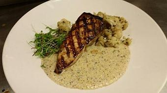 Product: Wood fired Block Island Swordfish over creamy buckwheat polenta and sautéed cauliflower with basil pesto and white wine. - Michael Anthony's at the Inn in Versailles, OH Restaurants/Food & Dining