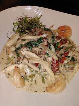 Product: Fresh spinach linguine with sauteed gulf shrimp, wild mushrooms, shallots, kale, and sun dried tomatoes in a white wine cream sauce with fresh herbs. - Michael Anthony's at the Inn in Versailles, OH Restaurants/Food & Dining