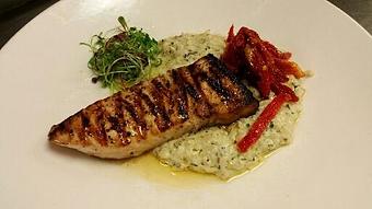 Product: Wood fired Swordfish over a basil pesto and sundried tomato risotto drizzled with balsamic reduction. - Michael Anthony's at the Inn in Versailles, OH Restaurants/Food & Dining