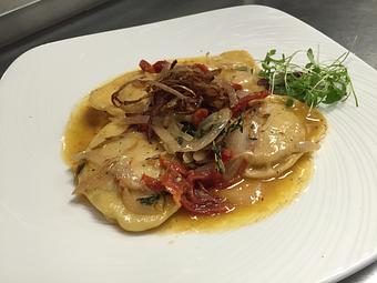 Product: Smoked Confit Chicken Agnolotti
Local cage free chicken, house smoked with sundried tomatoes, goat cheese, caramelized shallots, shaved garlic, extra virgin olive oil and baby arugula pesto. - Michael Anthony's at the Inn in Versailles, OH Restaurants/Food & Dining