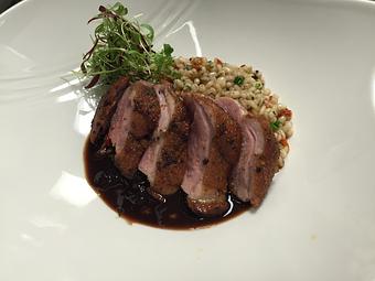 Product: Pan seared Maple Leaf Farm's Duck
House smoked breast, pan seared till crispy then oven roasted with a sundried blueberry demi-glace. Served with a warm barley, sundried tomato and micro herb salad. - Michael Anthony's at the Inn in Versailles, OH Restaurants/Food & Dining